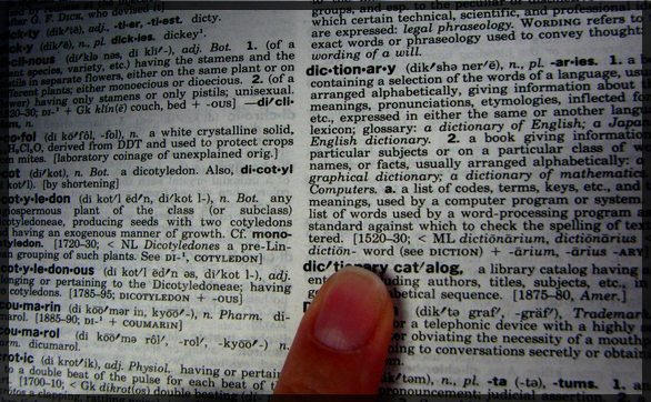 finger on dictionary page