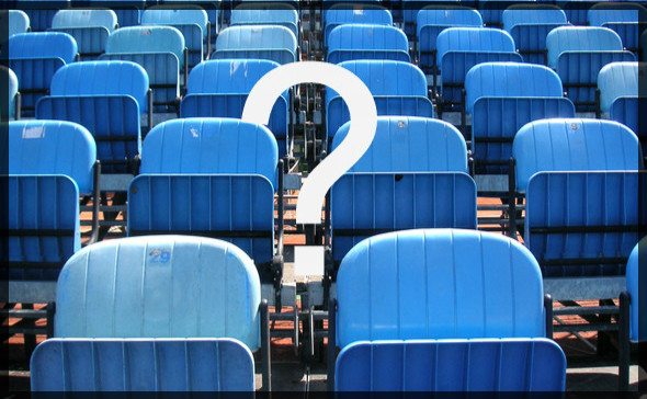 rows of empty blue seats with white question mark on top