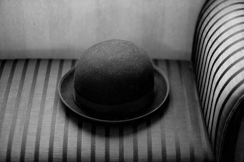 black top hat on top of a couch