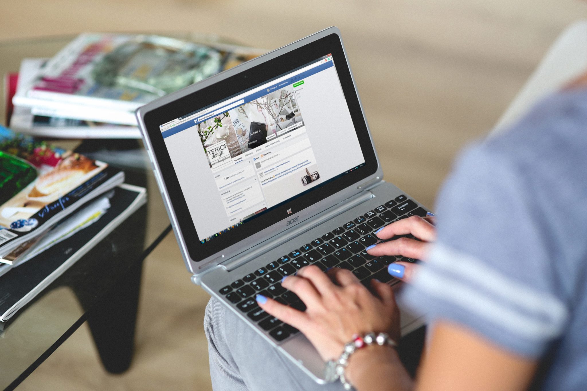 woman using a laptop for facebook business page