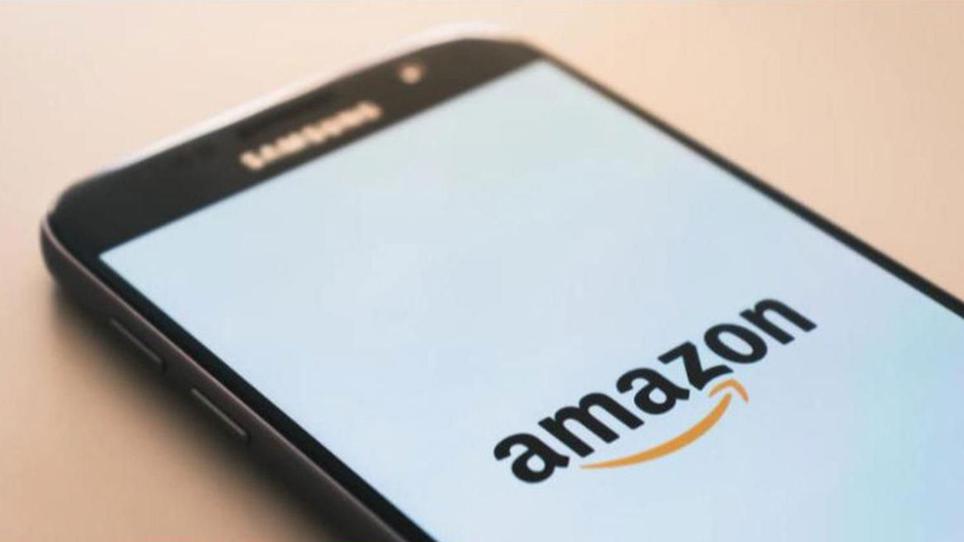 A smart phone with the Amazon logo on the screen.